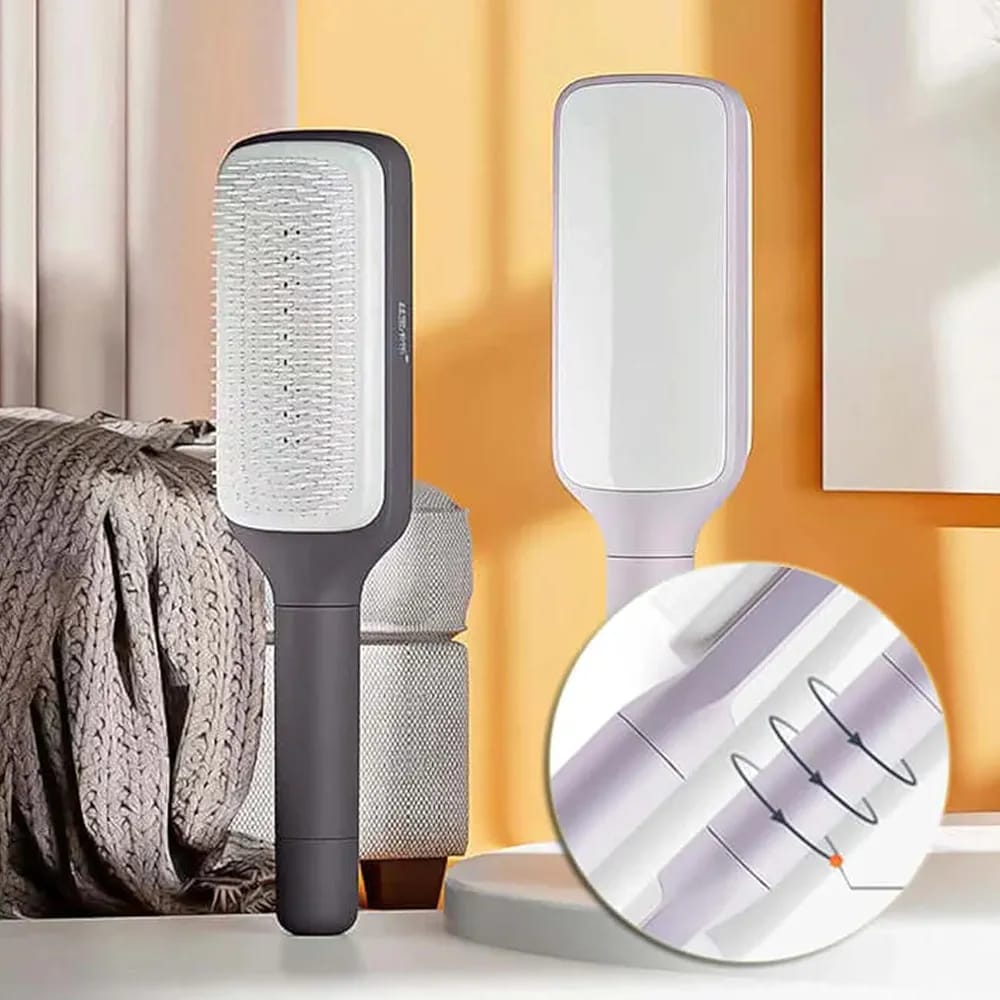 Self-cleaning hair brush ergonomic handle grip detail