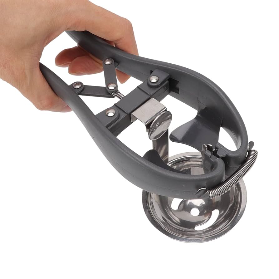 Stainless steel egg separator kitchen gadget close-up