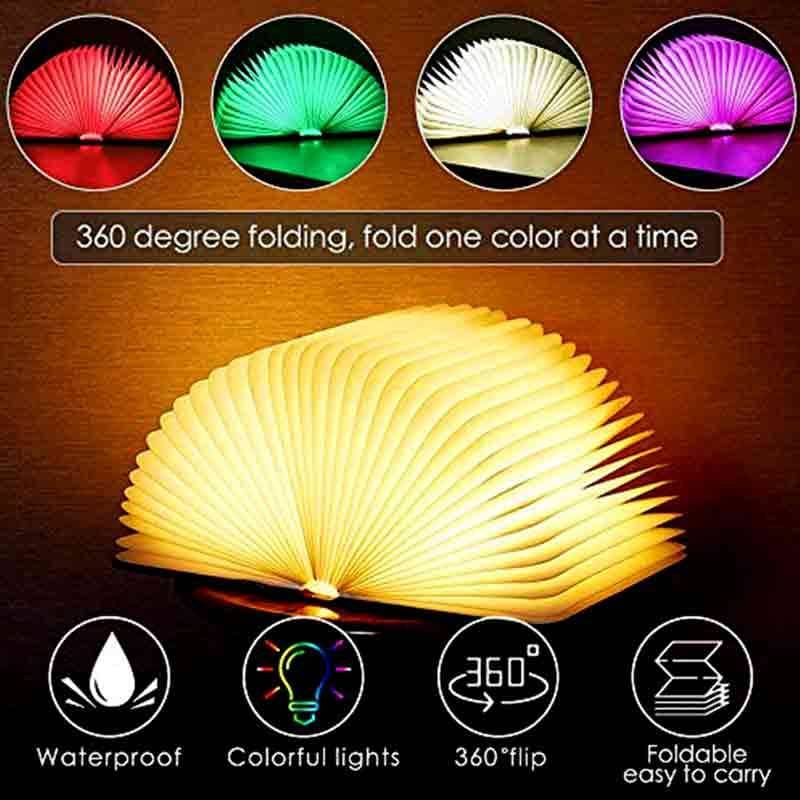 Wooden LED book light clipped to book warm glow